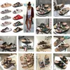 Flats Designers Women Sandals Mężczyzn Slajd dolne klapki Haftowane wydrukowane galaretki Gumowe skórzane kapcie 630