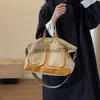 Bolsas de ombro Bolsa tote de lona com design de nicho e de alta qualidade para mulheres 2023 novo inverno de alta capacidade bolsa crossbody de ombro únicoH2422