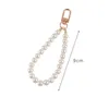 Porte-clés en alliage de perles pour femmes, 10 pièces, nouveau sac de voiture minimaliste, Bluetooth, couvre-chef, pendentif, bijoux, vente en gros, 240125