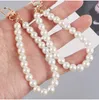 Porte-clés en alliage de perles pour femmes, 10 pièces, nouveau sac de voiture minimaliste, Bluetooth, couvre-chef, pendentif, bijoux, vente en gros, 240125