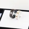 Bague en céramique double lettre bijoux pour femmes hommes or noir et blanc bilatéral creux G anneaux mode célébrité en ligne coup240n