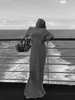 カジュアルドレスセクシーなニットビーチドレス女性ホロウアウトOネック長袖女性2024夏レディホワイトホリデーベスティドスを見る