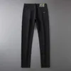 Męski projektant dżinsów Spring i Autumn Xintang Nowy czarny dla mężczyzn Slim Fit Małe stopy Elastyczna europejska marka mody Casual Long Pants EI52