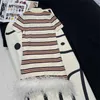 Basic Dresses designer 24 Early Spring New Nanyou Miu Fashion Age Reducing Contrast Stripe Spliced Feather Polo Neck Knitted Short sleeved Dress NHMI