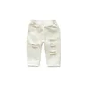 Primavera Autunno Neonate Jeans strappati Bambini Bambini Pantaloni con buco rotto Pantaloni di jeans in vita elastica per ragazze di colore bianco 240123