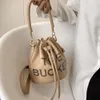 Niche mignon sac à bandoulière à bandoulière unique pour femmes, capable et polyvalent, sac seau pour femmes 2024 78% de réduction sur la vente en gros en magasin