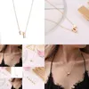 Andere Cross Europa en Amerika Mode 26 Engelse Letter Ketting Creatieve Perzik Hart Sleutelbeenketting Drop Delivery Otsvj