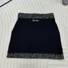 スカートデザイナー24早春に新しいニットハーフスカートファッショナブルな韓国語版コントラストカラービーズデザインハイグレードガール