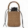 2023 Sommar Ny Vine Woven Bag Bamboo Festival Handhållen axelväska Pure Hand Woven Bag Fashion Cylinder Straw Woven Bag