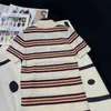 Basic Dresses designer 24 Early Spring New Nanyou Miu Fashion Age Reducing Contrast Stripe Spliced Feather Polo Neck Knitted Short sleeved Dress NHMI