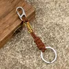 Keychains MKENDN Double Buckle Keychain Men Women Hand-woven Outdoor Rock Climbing Paracord Snake Knot Emergency Metal Key Rings