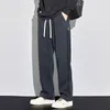 Calça masculina Moda coreana Loose Versátil Casual Men Stripe sólido Canda elástica Pockets Pockets de perna larga Larra esportiva reta