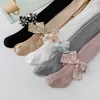 Collants à nœud fleuri pour enfants, bande de fosse, couleur unie, Leggings tout-en-un pour bébé, collants pour bébé, printemps et automne