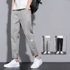 Männer Hosen Mid-rise Elastische Bund Kordelzug Taschen Männer Koreanischen Stil Einfarbig Gerade Bein Hosen