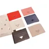 كلاسيكي حلقات المفاتيح المصمم للرجال والنساء عالية البطاقة BATCH BAG Premium Metal Triangle Bag Gift UU
