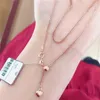 Collares colgantes Ruso 585 Oro púrpura Chopin Cadena Peach Heart Suéter plateado con 14K Rose Diseño de moda Joyería para mujeres