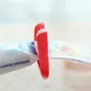 Conjunto acessório de banho Suporte de pasta de dente de duas cores Opcional Multiuso Material preferido Forma nova Produtos domésticos Extrusora Bulk Simples