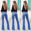 Pantaloni da donna Autunno e inverno Jeans da donna Tasche applicate Sexy sottili Gamba larga svasati Slim a vita alta