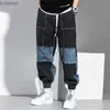 Jeans da uomo Jeans da uomo Hip Hop Pantaloni cargo abbinati a colori Pantaloni harem con chiusura ampia Autunno Jeans patchwork da uomo neri Jeans denim oversize YQ240205