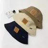 Chapeau de pêcheur européen et américain Les étoiles montrent le visage avec de petits créateurs Chapeau de pot polyvalent Automne et hiver Pare-soleil et chapeau de protection solaire Tendance