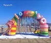 Nome dell'articolo wholesale Arco arcobaleno gonfiabile all'aperto 7m 23ft Arco colorato di caramella curvo di esplosione dell'aria di larghezza per la decorazione dell'ingresso del parco e del circo