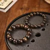 Bracelet de perles de bouddha en bois doré et soie Nanmu, brin Yin Chen, ondulation de l'eau, avec jeu d'ombre ondulée