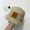 Chapeau de pêcheur européen et américain Les étoiles montrent le visage avec de petits créateurs Chapeau de pot polyvalent Automne et hiver Pare-soleil et chapeau de protection solaire Tendance