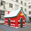 Tente gonflable de Noël en plein air 6x4x4m 20ftx10ftx10ft Maison rouge soufflée à l'air Cottage de village de Noël géant pour la décoration de Noël d'hiver