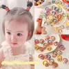 ヘアアクセサリー10pcs/setかわいい漫画ベアバンドガールズエラスティックラバーヘッドウェアフラワーボウベビーキッズ飾り