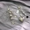 Pendentif de sac en perles de vent doux et frais, en métal noir, blanc, argent, ours, croix d'amour, porte-clés de voiture, ornements