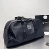 M41414/M41418 Designer Keepall Bagage Bag Mężczyźni Mężczyźni Mężczyźni Mody Projektant Torba podróży Duża torebka metalowa wisiorek na płótnie skórzane jedno ramienie