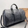 M41414/M41418 Designer Keepall Bagage Bag Mężczyźni Mężczyźni Mężczyźni Mody Projektant Torba podróży Duża torebka metalowa wisiorek na płótnie skórzane jedno ramienie