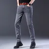 Modne dżinsy mężczyźni w stylu koreański proste szare środkowe spodnie w talii męskie dżinsowe spodnie 240130