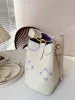 Mode kvinnors lyxdesigner Poi Bobo -serien Nano Mini Bucket Bag Women Handbag Crossbody Bag Elegant Touch Soft Fairy Instant Visual Sensation