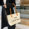 Lona grande capacidade para mulheres novo e capaz bolsa de ombro textura net vermelho impresso carta bolsa 2024 78% fora da loja atacado