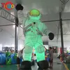 Activités de plein air 8 mH (26 pieds) avec ventilateur publicitaire ballon à air de dessin animé astronaute gonflable géant Spaceman avec lumière LED à vendre