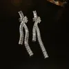 Boucles d'oreilles pendantes de luxe nouées pour femmes, accessoires de fête de mariage en Zircon brillant, glands, anneaux d'oreilles, bijoux Sexy, cadeaux KAE003