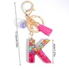 Keychains 1pc Letter Shaped Drip Glue Keychain Handbag Decoration Purple Star Sequins Ball And Tassel Decor Rose Red Gift Cute Key Rings