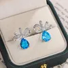 Pendientes de tuerca que venden circonita azul exquisita para mujer, joyería de fiesta a la moda, lazo, boda, novia