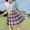 Faldas moda Primavera Verano mujeres cintura alta seguridad cuadros plisado A-Line Mini falda dulce chica estudiante baile Casual Sk6