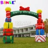 wholesale Arco de Navidad inflable gigante estilo castillo de 8 mW y 26,2 pies de ancho con caja de regalo con bomba Arco para eventos de fácil instalación para decoración de césped al aire libre