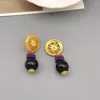 Dingle örhängen europeiska och amerikanska retro ihåliga skivglassten droppe för kvinnor elegansplätering 18k guld smycken grossist
