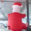 Atacado atividades de jogos ao ar livre 20 pés de altura inflável grande papai noel 6m de altura sentado tipo papai noel gigante para decoração de natal