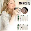 Unghie finte verde diamante dorato finto con delicati ornamenti di diamanti per uso domestico nella scuola di nail art