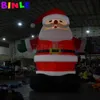 10mH (33ft) vente en gros fantastique père Noël gonflable géant de Noël avec des gants verts souffleur de ceintures noires pour les décorations extérieures