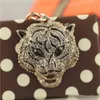 Portachiavi moda carino piccolo regalo souvenir borsa accessori metallo portachiavi auto portachiavi testa di leopardo anello pendente animale