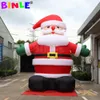 10mH (33ft) vente en gros fantastique père Noël gonflable géant de Noël avec des gants verts souffleur de ceintures noires pour les décorations extérieures