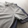Dukeen Polo tinta unita per uomo Abbigliamento da golf a maniche corte Estate Coreano stile tinta unita T-shirt Abbigliamento uomo Camicetta bianca 240202