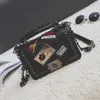 2023 New Stereoscopic Lock Buckle Small Square with Multi Element Medal Single Shoulder Diagonal Straddle Handheld Women's Bag 75% factory direct sales