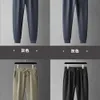 Spring and Autumn Leisure Guard Pants for Men's Slim Fit Versatile Trendy Embroidered Tie Feet Sports Pants